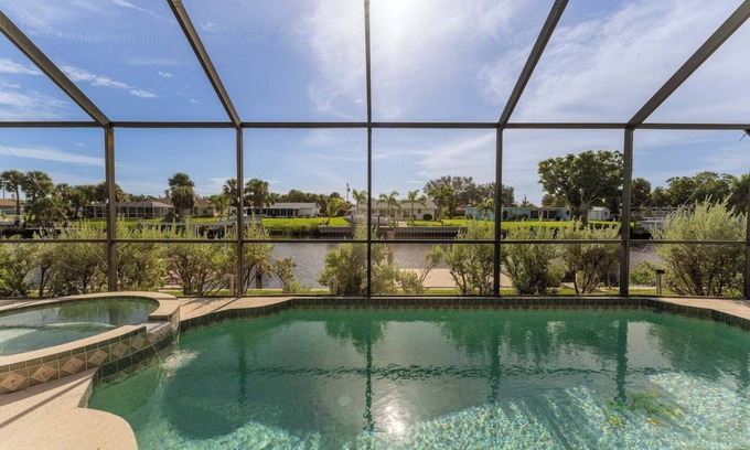 Port Charlotte House | GoGo House. Charming 2 BR, 2 BA, Waterfront Vacation Rental in Port Charlotte, FL, w/Heated Private Pool & Spa
