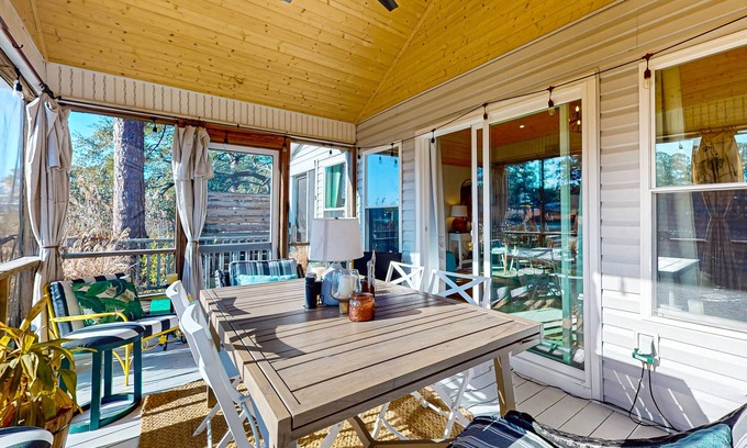 Shallotte House | Gorgeous creekside cottage with firepit, board games, dock, deck, & washer/dryer