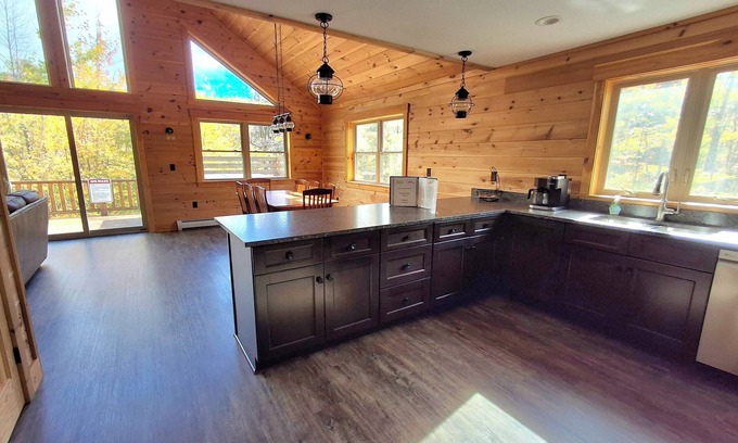Carrabassett Valley Cabin | Gorgeous dog-friendly cabin with great view, deck, hot tub, & gas fireplace