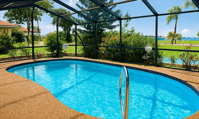 Pebble Beach House | !HEATED POOL/LANAI-BBQ-CANAL WATERFRONT-NEAR BEACH/GOLF/PARK/TENNIS/RESTAURANTS!