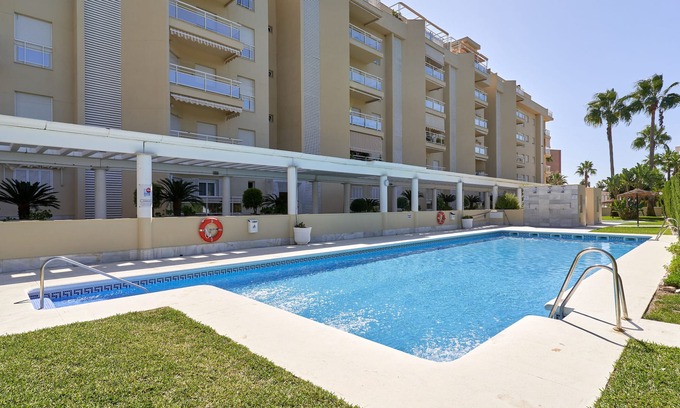 Playa Granada Apartment | Holiday Apartment "Luxury On The Beachfront" near beach with Shared Pool & Wi-Fi