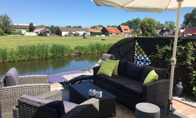 Onderdijk House | Holiday home in Wervershoof with barbecue, terrace and garden