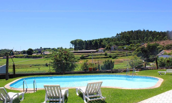 Vila Nova de Famalicao House | Homerez - House for 4 ppl. with shared pool, garden and balcony at Requião