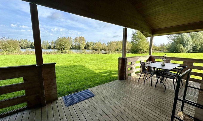 Ampney Crucis House | Iris Lodge with wood burner on Lake Pochard