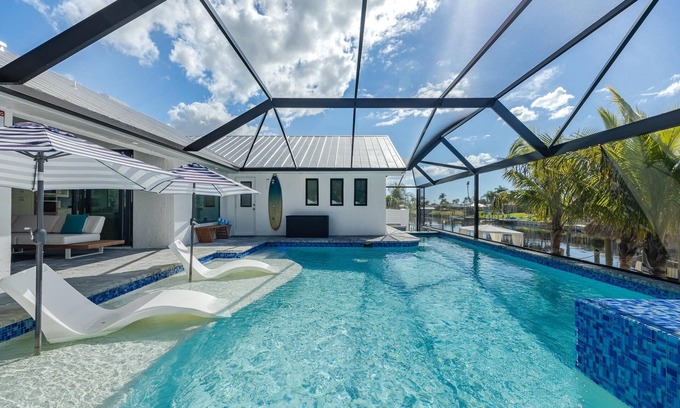 Cape Coral House | Kayaks, Boat Dock, Heated Pool & Spa, Outside Kitchen, Tiki Hut - Villa Pedro - Roelens Vacations