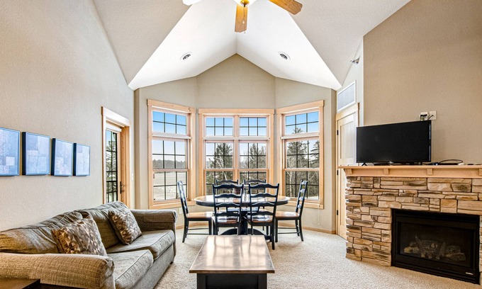 Three Lakes Condo | Lakefront condo with 2 balconies, loft, fireplace, W/D, indoor pool, & hot tubs