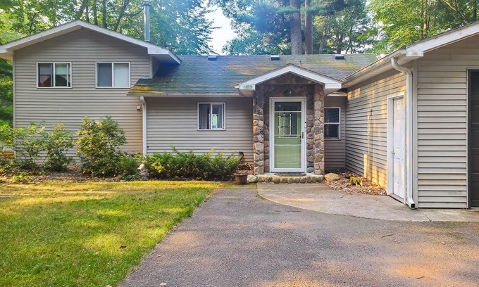 Arbor Vitae House | Lakefront home with large patio, fire pit, W/D & WIFI