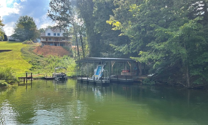 Winchester House | Lakefront home with dock. Cozy 2 bed 2 bath and screened in porch.