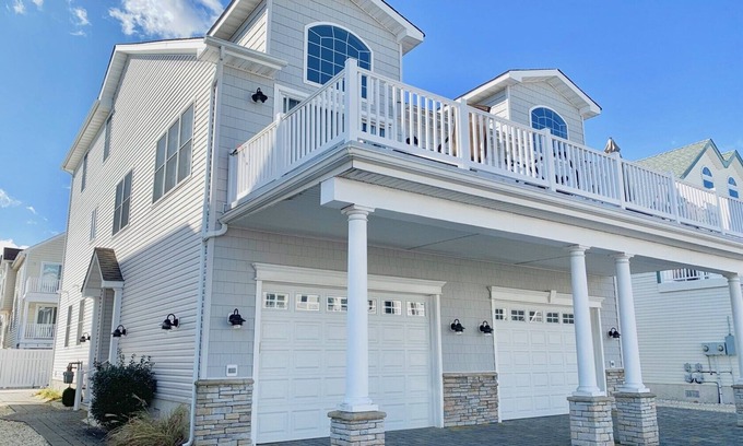 Townsend's Inlet House | Large deck off the living room with bay views. About 3 blocks to the beach.