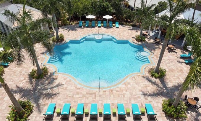 New Town Hotel | Live the Island Life | Pool, Lawn Games, Cabanas & Karaoke Nights