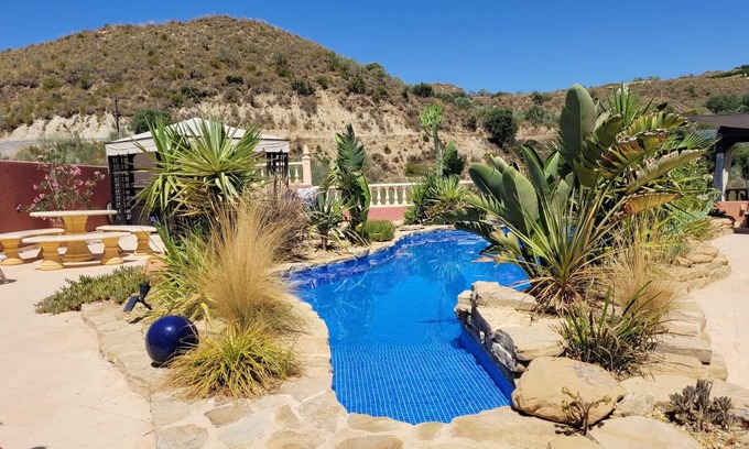 El Cortijo Grande Villa | Lovely villa with natural style swimming pool, fab outside area with great views