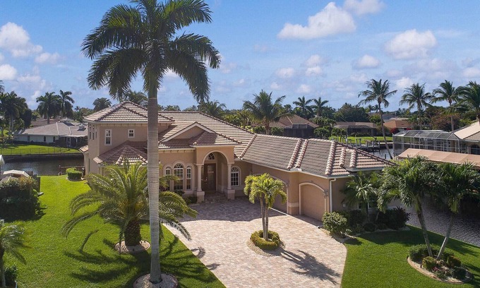 Caloosahatchee Villa | Luxe Canal Villa! Direct Gulf access pool home, sleeps up to 15.