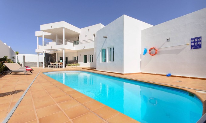 Costa Teguise Villa | Luxurious Villa with Panoramic View, Multiple Terraces and Large Pool
