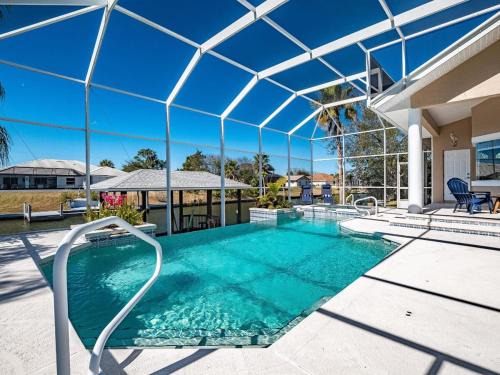 Palm Harbor House | Luxury 4-Bedroom Canal Home with Pool