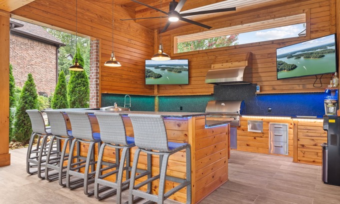 Buford House | Luxury Lakefront retreat. Privacy gate, pool and outdoor kitchen