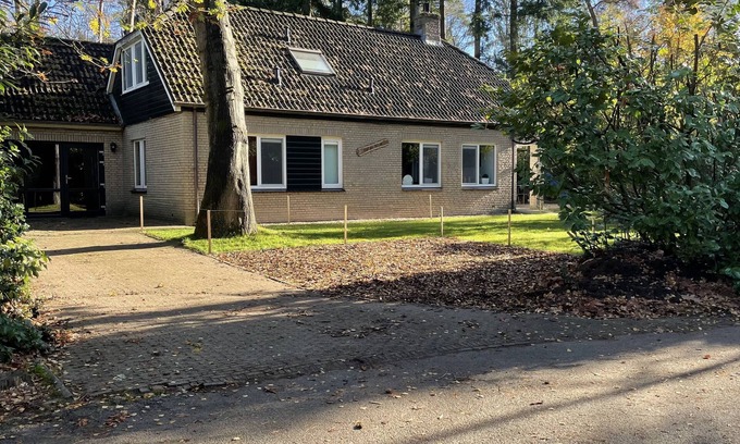 Lochem House | Luxury vacation home with bar billiards and sauna in wooded area