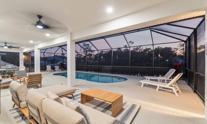 Palm Harbor House | Luxury Waterfront Escape – Private Dock, Heated Pool & Game Room! Pet-Friendly!