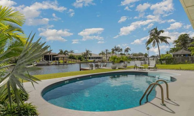 Cocoa Beach House | Luxury Waterfront -Heated Pool, Dock, Bikes & Paddleboards - Mins to Beach