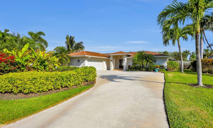 Palm River Estates House | Modern home with a pool, patio, hot tub, grill, washer/dryer, and central AC
