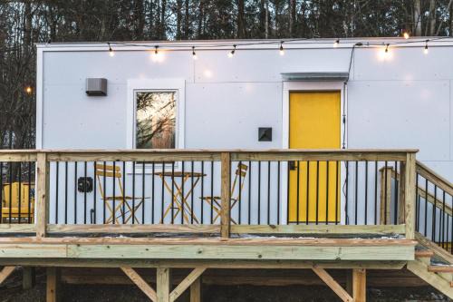 Johnson House | Modern Tiny House with hot tub & river near Stowe