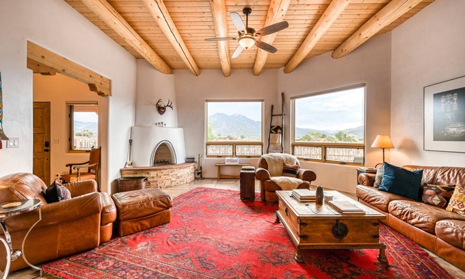 Taos House | Mountain view home with a fireplace, hot tub, washer/dryer & gas grill