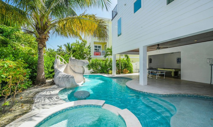 Bradenton Beach House | Multi family beach house! 9 bedrooms, pool with waterslide + rooftop deck