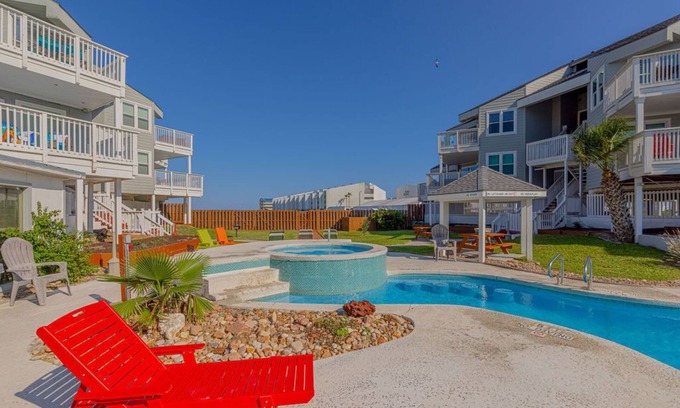 Port Aransas Condo | MUSTANG ISLAND POOLSIDE PARADISE - Boardwalk to beach, heated pool. hot tub!