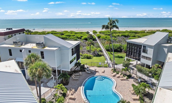 Sanibel House | New Cyprina Unit #2 – a fully renovated, Serena & Lily–inspired townhome on Sanibel’s sought-after East End. This luxury beach retreat seamlessly blends coastal elegance with modern comfort, offering breathtaking direct water views from every room.