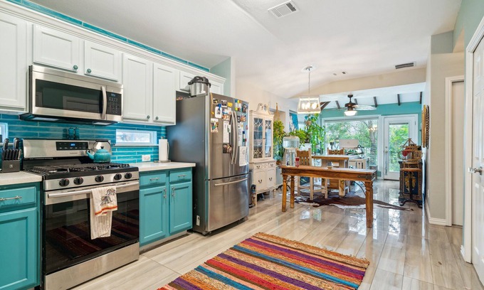 Kyle House | NEW LISTING! Eclectic Oasis: Artful & Colorful Comfort by RedAwning