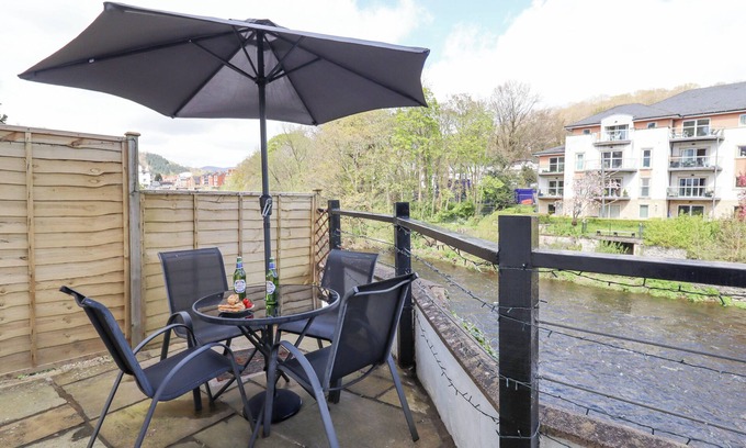 Llangollen Cottage | NO. 9 ON THE RIVERBANK, pet friendly, with open fire in Llangollen