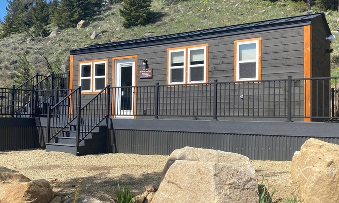 Red Lodge House | Our comfortable tiny cabin features Big amenities: Plush queen bed, galley kitchen, T.V., Internet, Fireplace & private bathroom, with shower & composting toilet. Large deck with seating areas, Bbq grill, table with umbrella & chairs. Plus lots of Vi