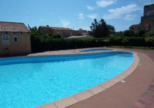 Solenzara Apartment | PALMERAIE 412- piscine en résidence-clim-wifi