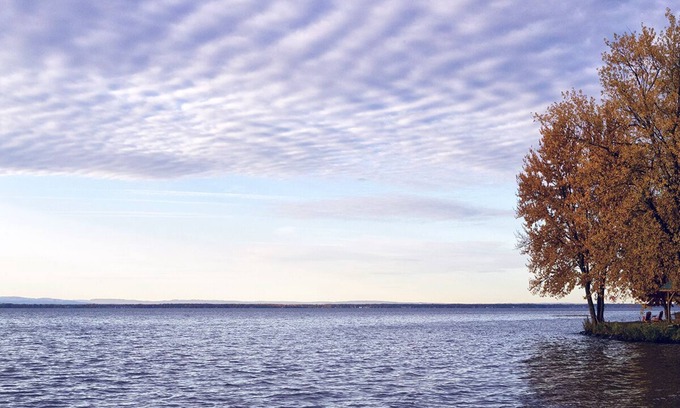 Bernhards Bay Cottage | Peaceful couples retreat on Oneida Lake. Insta-worthy views. Cozy interior.