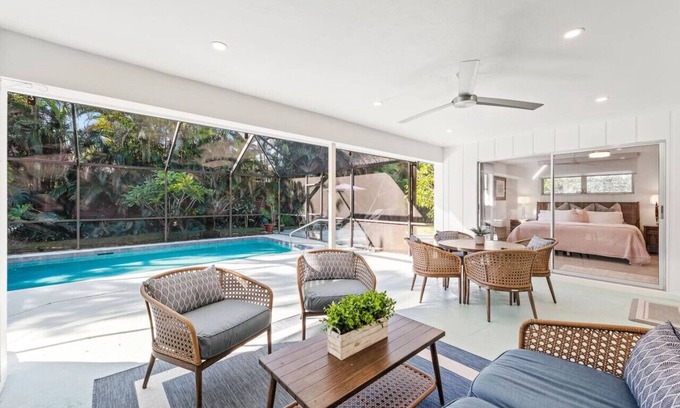 Moorings House | Pesaro Vacation Rental: Stylish 3-BR Retreat Near Via Miramar Beach. Renovated Home with Private Pool, Lush Gardens and Modern Comforts. Perfect for Families, Close to Beaches and Downtown Naples!