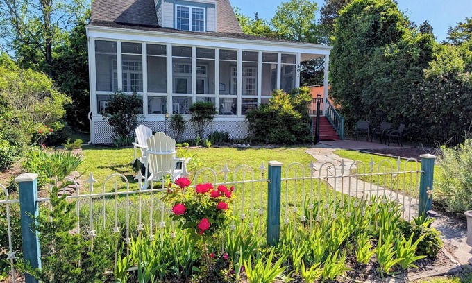 Cape May Point House | Pristine, Cozy, 4 bedroom Beach Cottage with a 40 foot screened in front porch!