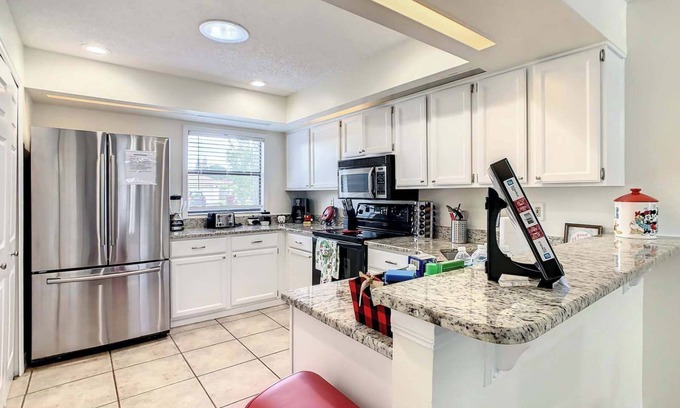 Poinciana House | Private 4BR Bungalow with Screened pool large yard