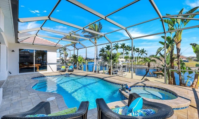Burnt Store House | Quick Gulf Access Pool/Spa Home with Games Room + Tiki Hut