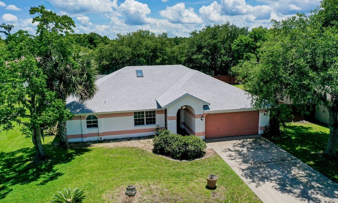 Palm Coast House | Quiet home with enclosed yard, heated pool with jets, & screened lanai