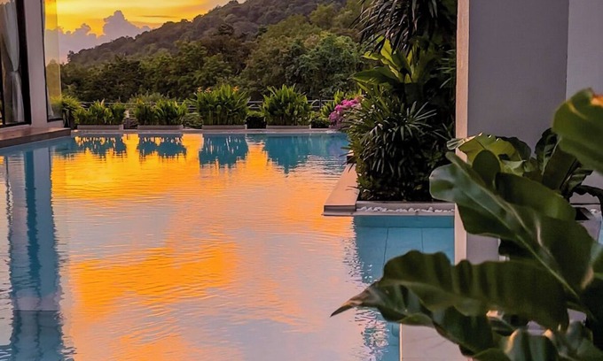 Patong Condo | Relax in a Spacious Deluxe King Room with Mountain &Distant Sea View