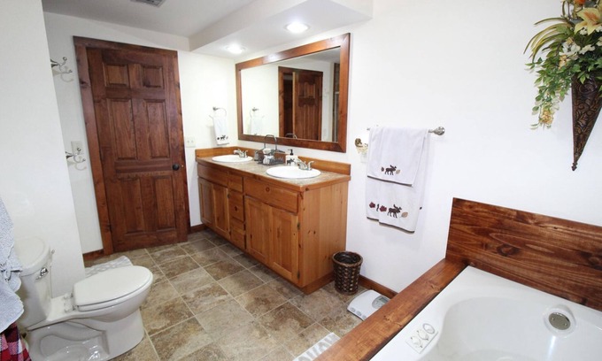 Grayling House | Relax, Unwind and Enjoy. Rustic log cabin with private Au Sable River Frontage!