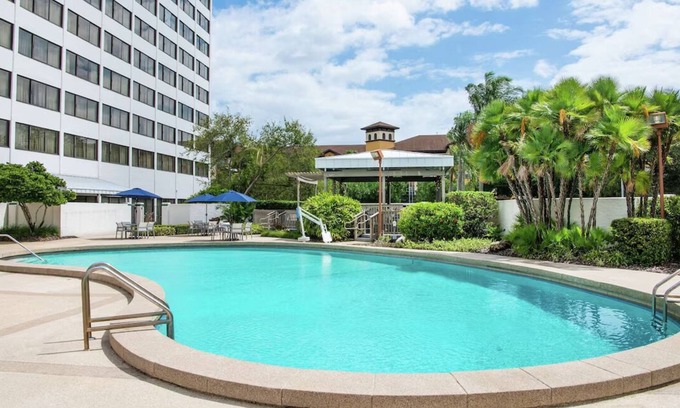 Carver City - Lincoln Gardens Hotel | Relaxing Room with Pool Access - Perfect Tampa Stay Near the Airport