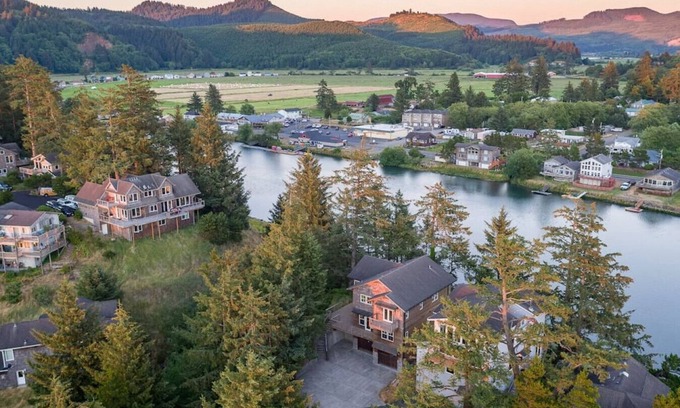 Pacific City House | Riverfront Dream is a luxurious 6 bedroom home on the bank of the Nestucca River.