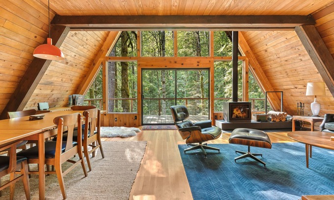 Rhododendron Cabin | Riverside A-frame in gated cabin community with private deck, woodstove, & W/D