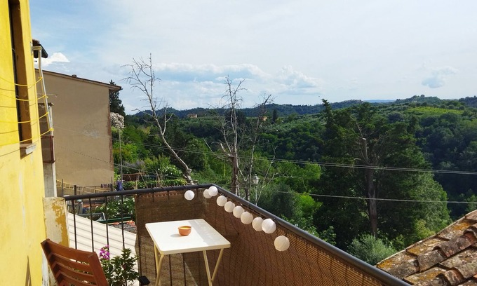 Montopoli in Val d'Arno Apartment | Rustic apartment with balcony and panoramic views of Tuscany