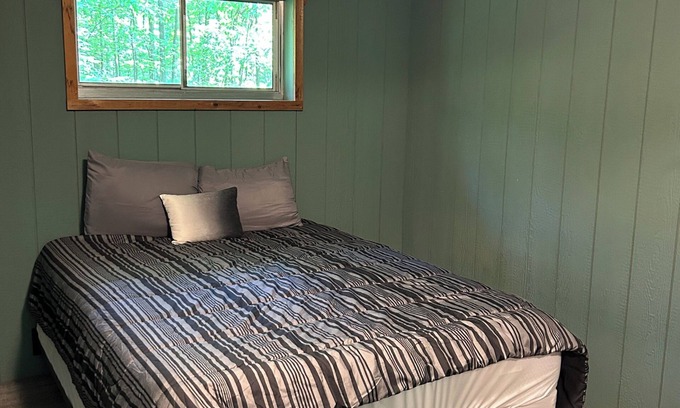 Palmyra Cabin | Rustic cabins in secluded campground with lake access and woods to wander in.