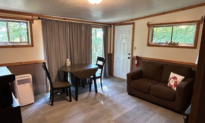 Palmyra Cottage | Rustic cabins in secluded campground with lake access and woods to wander in.