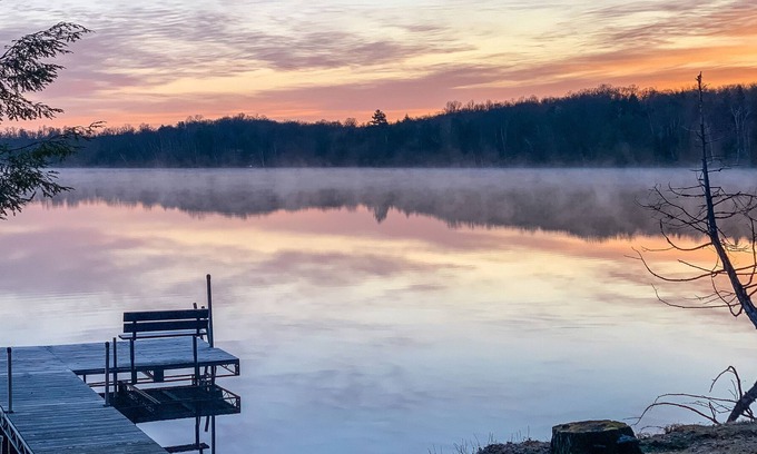 Presque Isle House | Rustic Lakeside Home with Dock, Firepit, Lake Views, and Screened-In Porch