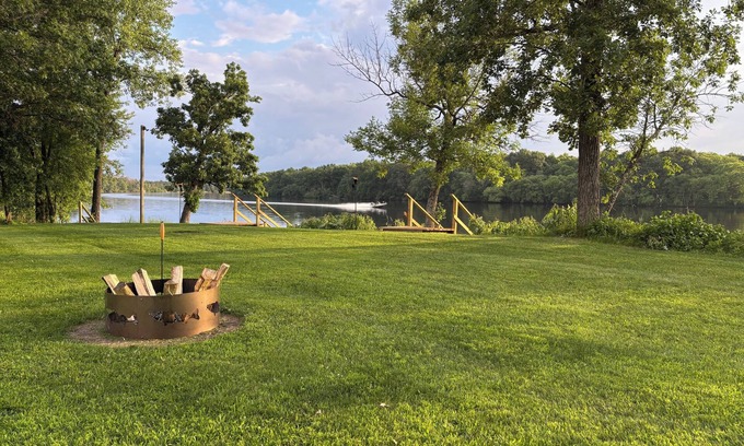 Nekoosa Cabin | Scenic riverfront cottage with boat landing and docks.