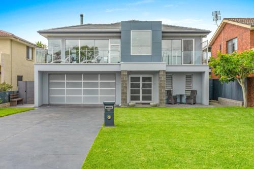 Culburra Beach House | Sea La Vie - Pet Friendly with Fireplace and Swimming Pool & Spa