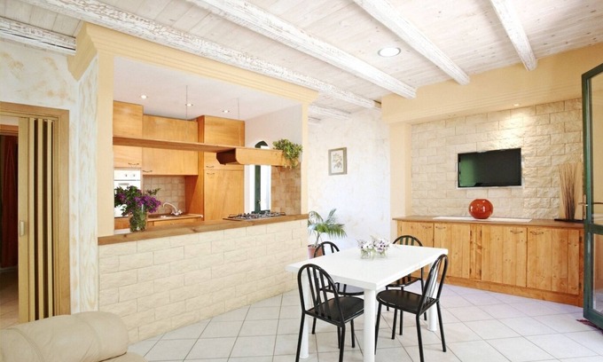 Chia Villa | Seaside villa with garden and panoramic mountain views.